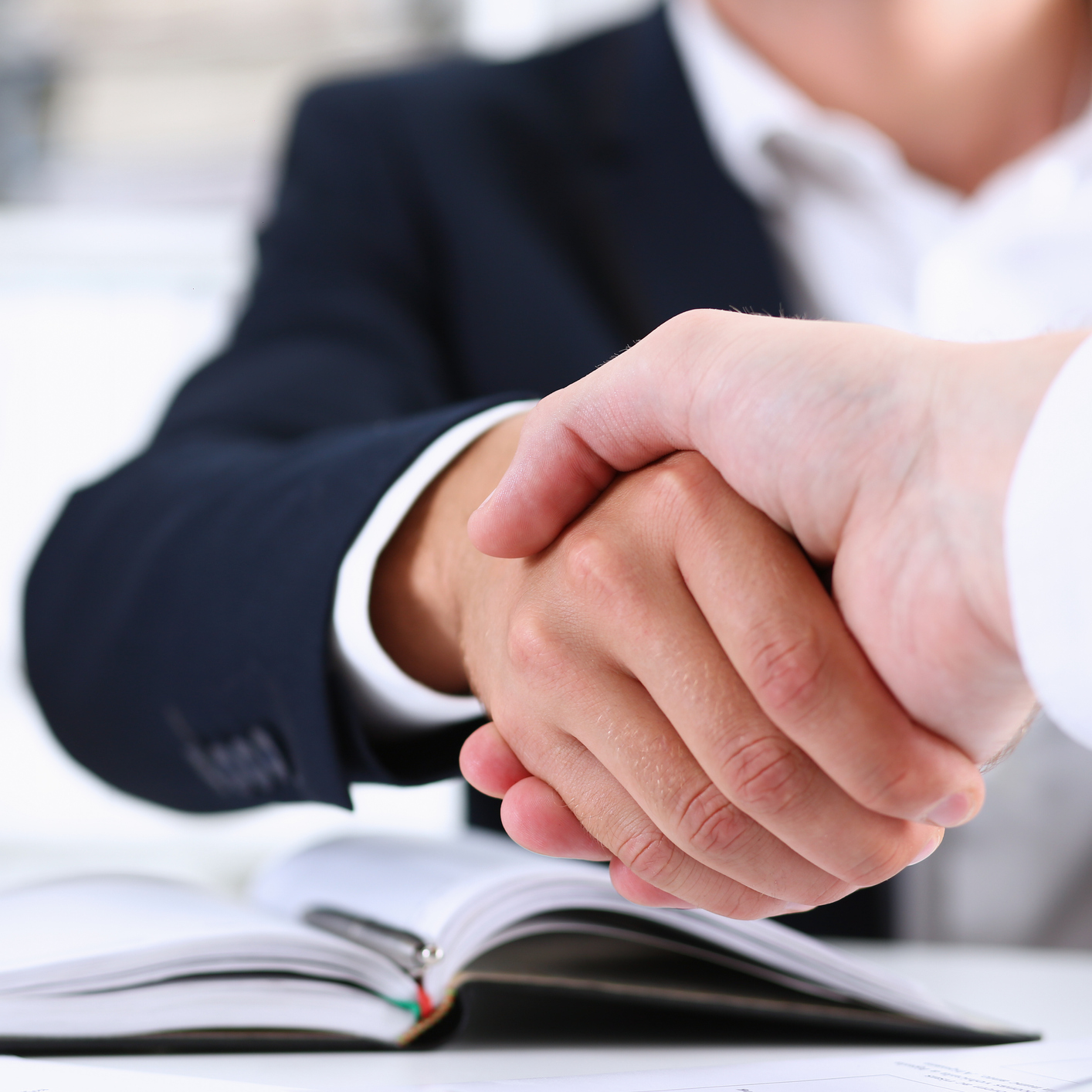 Man in suit shake hand