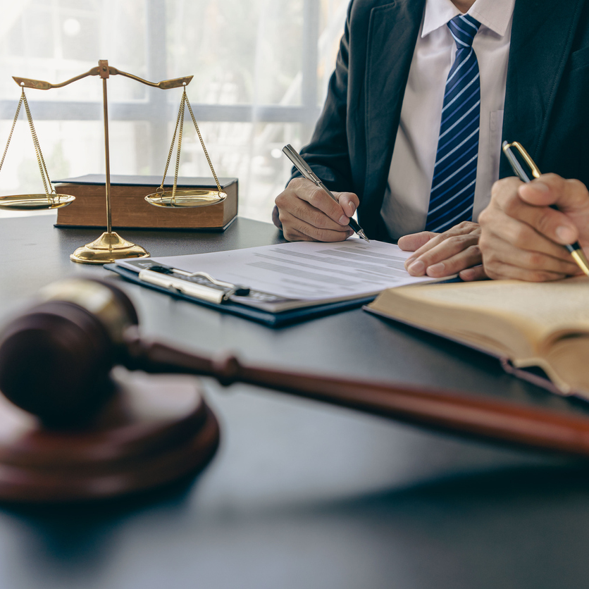 legal advisory office Lawyer in with hammer, symbol of justice Lawyer businessman working or reading law book in workplace for lawyer consulting concept